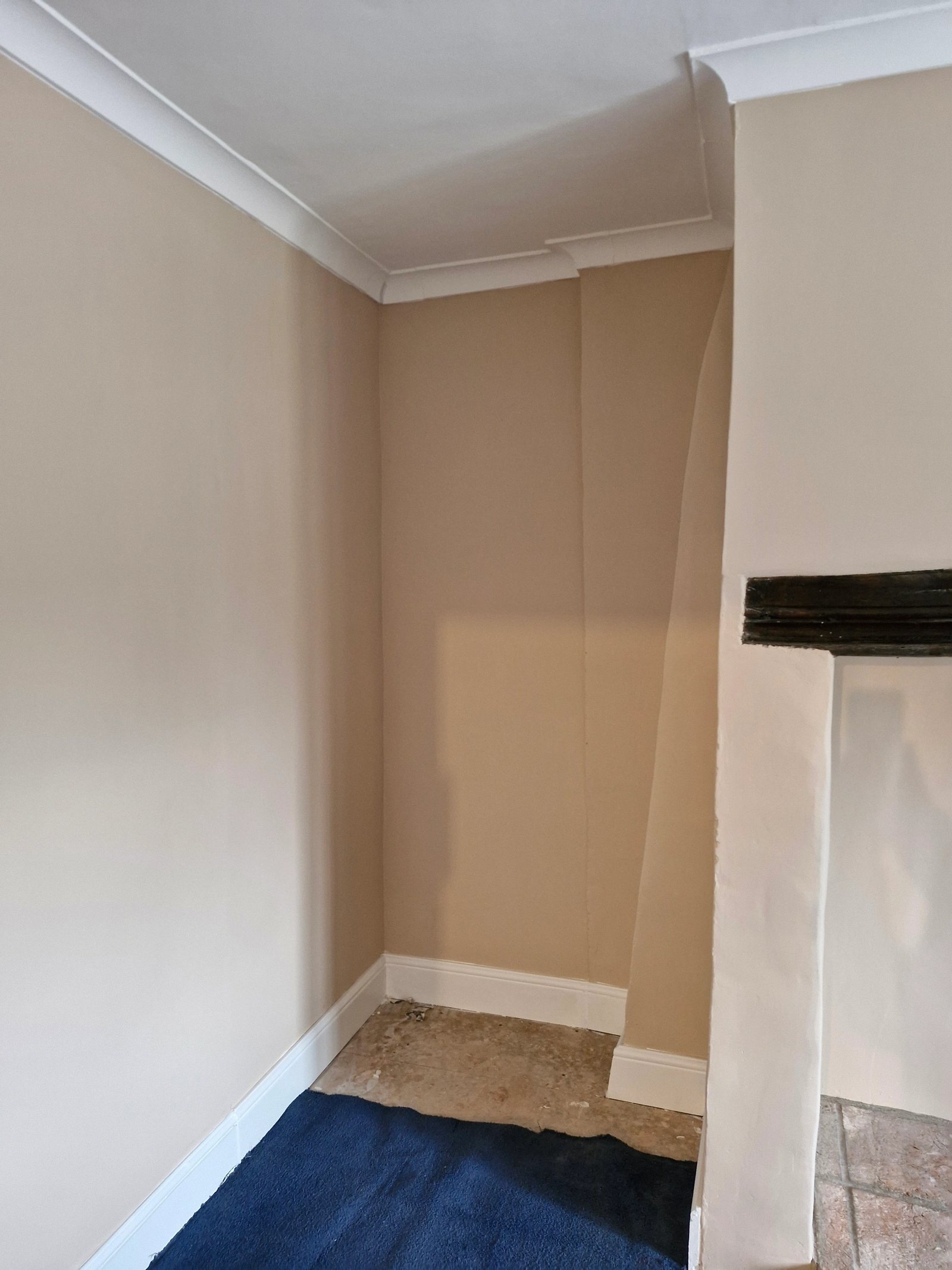 Room stripped back to bare walls and floorboards ready for refurbishment