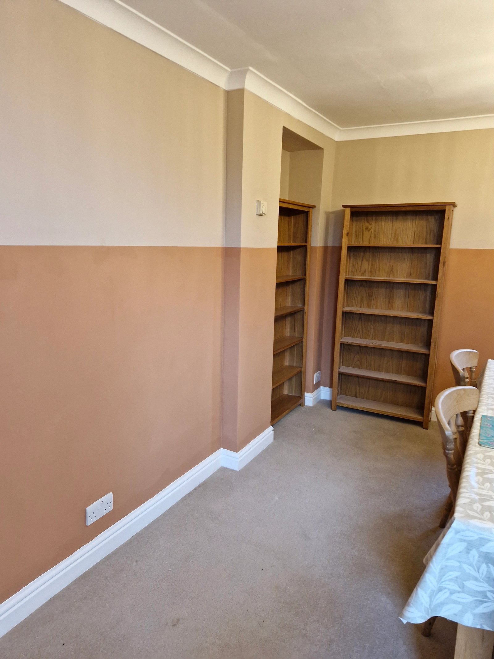 Fitted alcove shelving in a period reception room in Norfolk